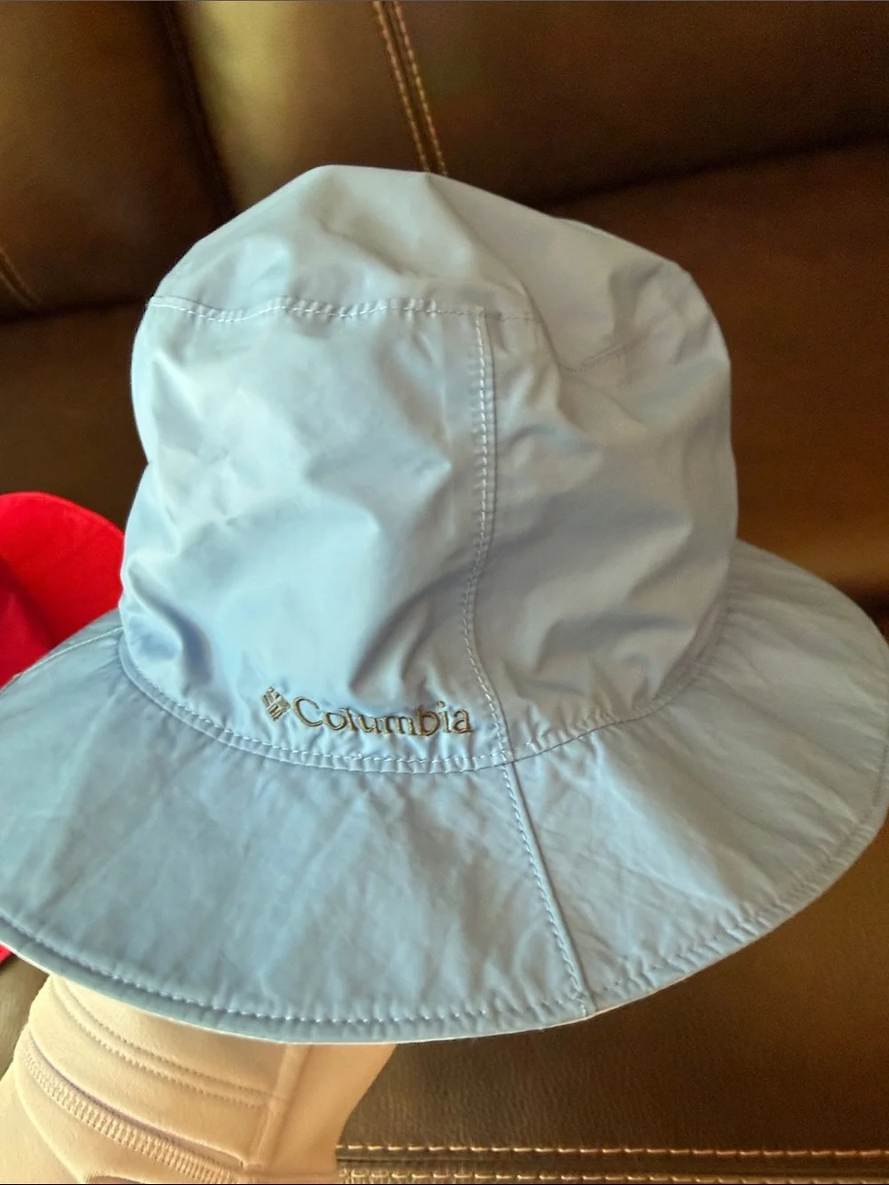 2 Columbia Kids Bucket Hats in Red and Light Blue.